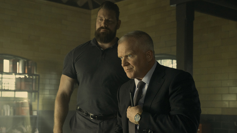 Paulie towering over Beck in Reacher