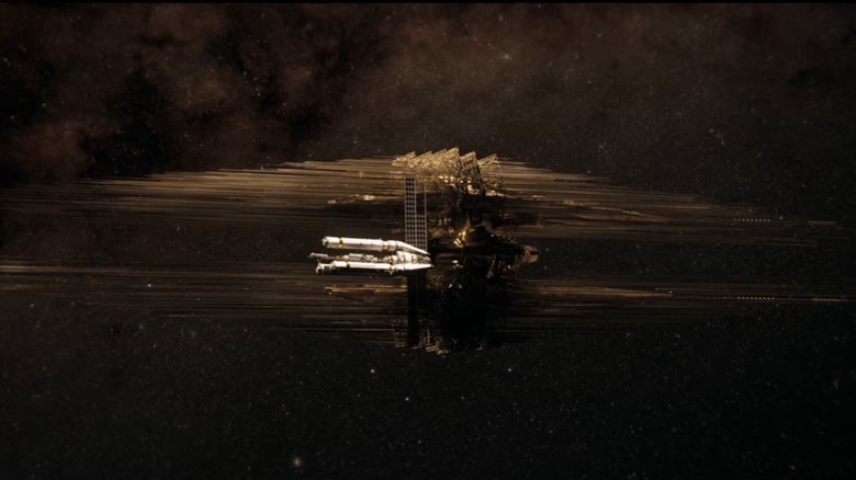 A human spaceship floats in space next to a massive alien craft in Project Hail Mary