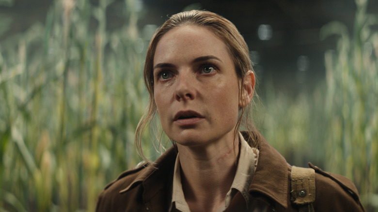 Juliette Nichols standing in an underground corn field in Silo