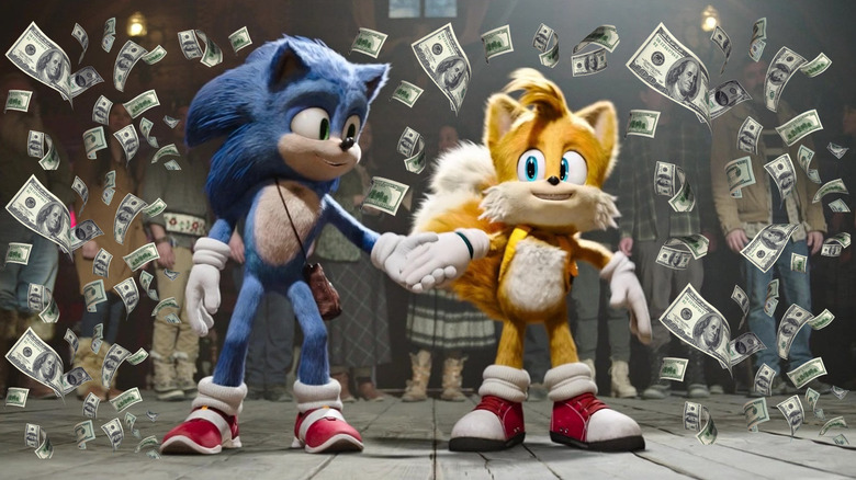 Sonic and Tails holding hands surrounded by money in Sonic the Hedgehog 2