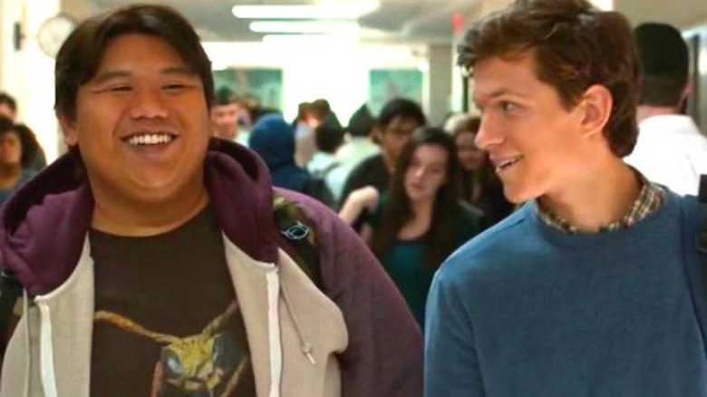 Ned Leeds and Peter Parker smiling in a hallway