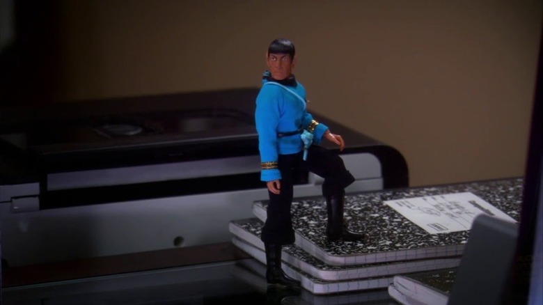 The Spock action figure standing upright on The Big Bang Theory