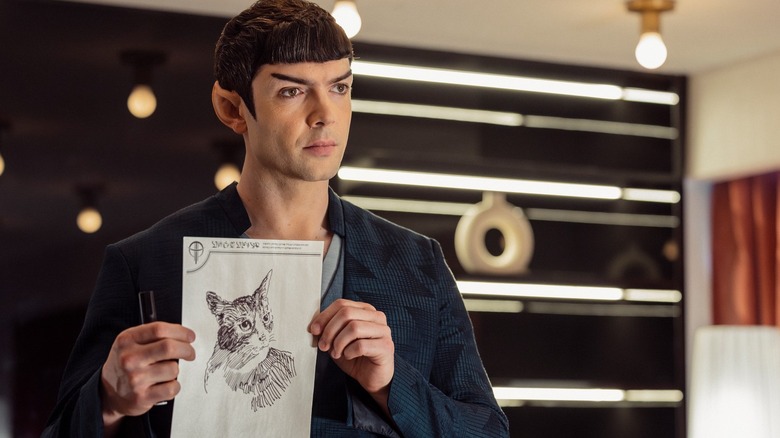 Spock (Ethan Peck) holds up a drawing of a cat in Star Trek: Strange New Worlds season 4