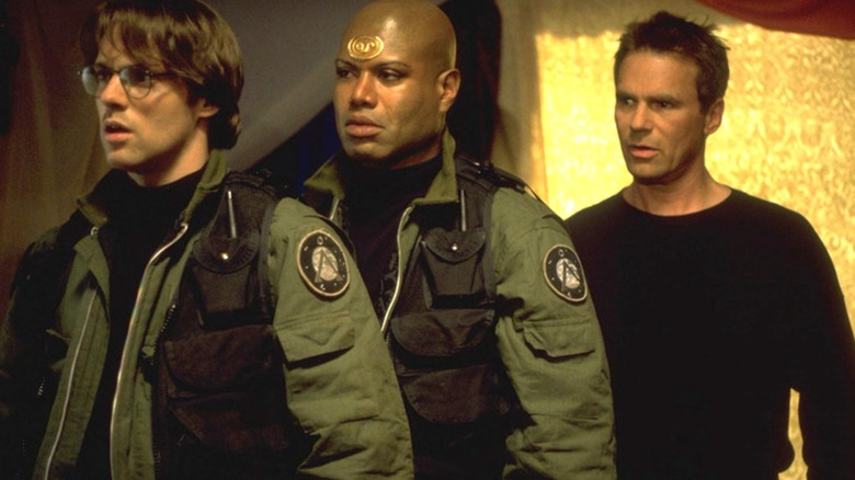 Daniel Jackson, Tel, Colonel Jack or Neil stare at someone in disbelief in Stargate SG-1