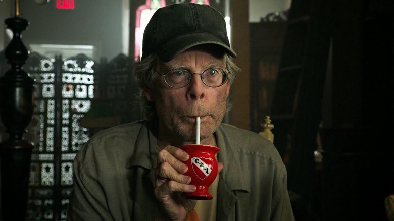 Stephen King drinking from red cup in It Chapter Two