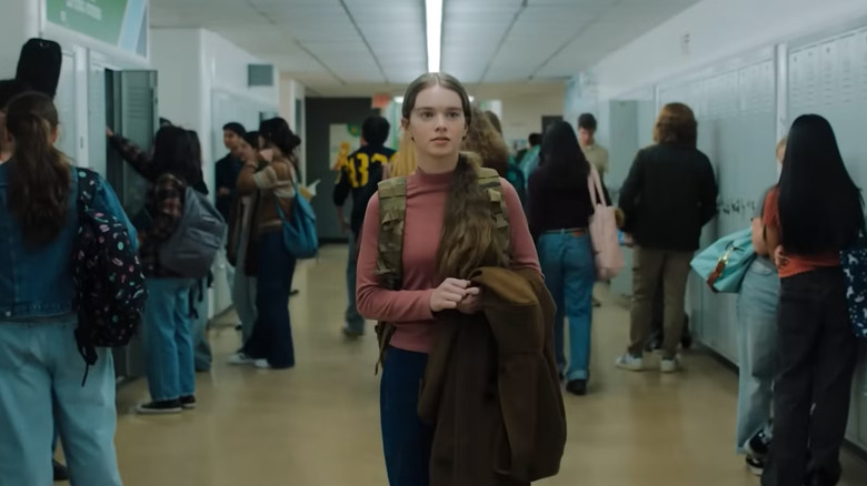 Carrie White walking down a hallway in Carrie