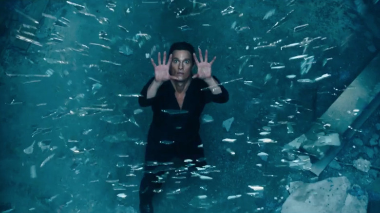 Matthew Makkoni Walter Padik looks at the fragments of glass falling in the dark tower
