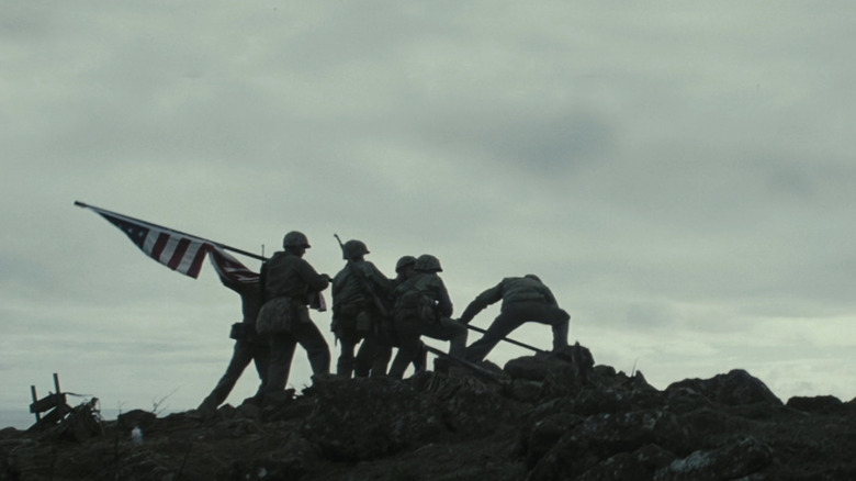 Soldiers raise an American Flag on Iwo Jima in Flags of Our Fathers