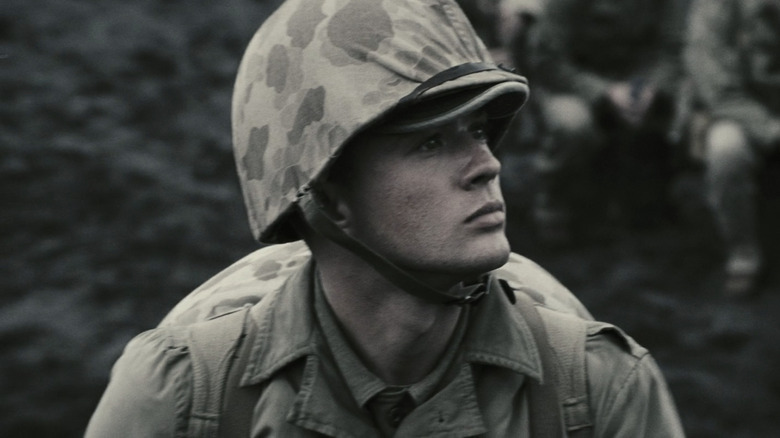 Ryan Phillippe's John Bradley stands on a battle field in Flags of Our Fathers