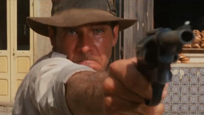 Indiana Jones pointing a gun