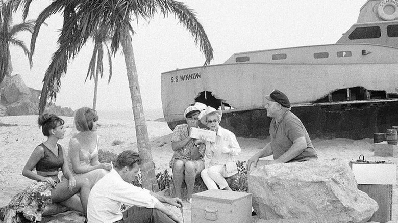 The castaways of Gilligan's Island nearby the damaged Minnow on Gilligan's Island.