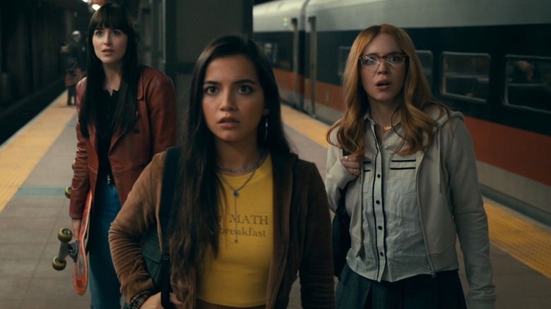Cassi, Anya, and Julia at the subway station seemed afraid in Madame Web