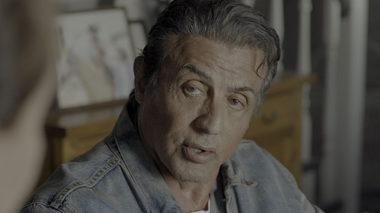 Sylvester Stallone as John Rambo talking to someone in Rambo: Last Blood