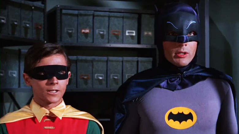 Burt Ward's Robin stands beside Adam West's Batman in the Batman TV series