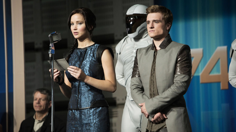 Katniss, a Peacekeeper and Peeta in Catching Fire