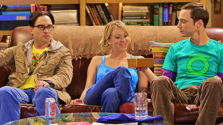Sheldon passing Penny chocolates in front of Leonard on The Big Bang Theory