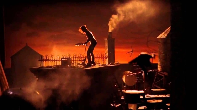 Brandon Lee playing guitar The Crow