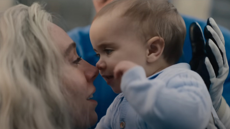 The Fantastic Four: First Steps -- Sue Storm holding her baby son Franklin up to her face