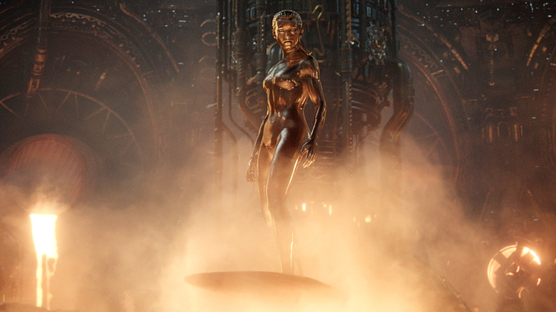 Julia Garner's Silver Surfer stands on her silver surfboard in Marvel Studios' The Fantastic Four: First Steps.