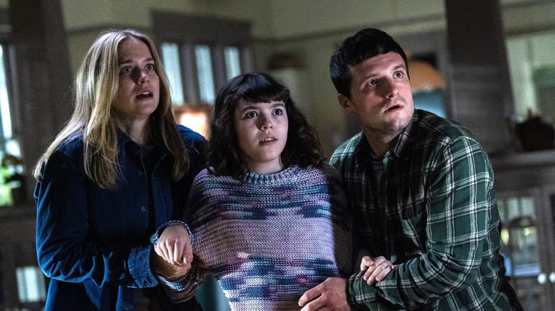 Vanessa and Mike holding a scared Abby in Five Nights at Freddy's 2