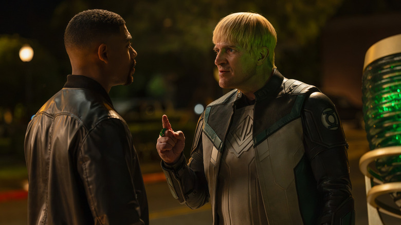 Aaron Pierre's John Stewart squares up to Nathan Fillion's Guy Gardner on a street at night in Lanterns