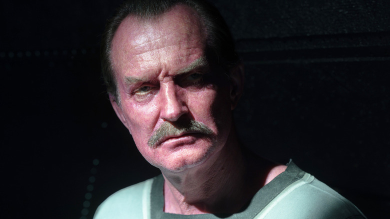 Ulrich Thomsen's Thaal Sinestro is seen surrounded by black in Lanterns.jpg