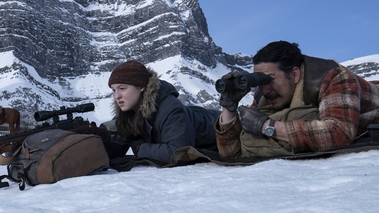 Ellie and Tommy looking down a mountain in The Last of Us