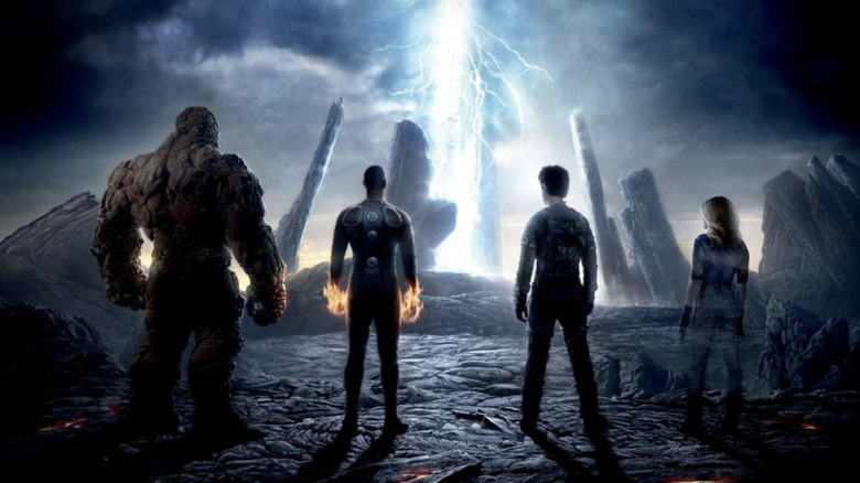 The Thing, Human Torch,  Mister Fantastic, and Invisible Woman looking at a portal on Planet Zero in Fantastic Four (2015)