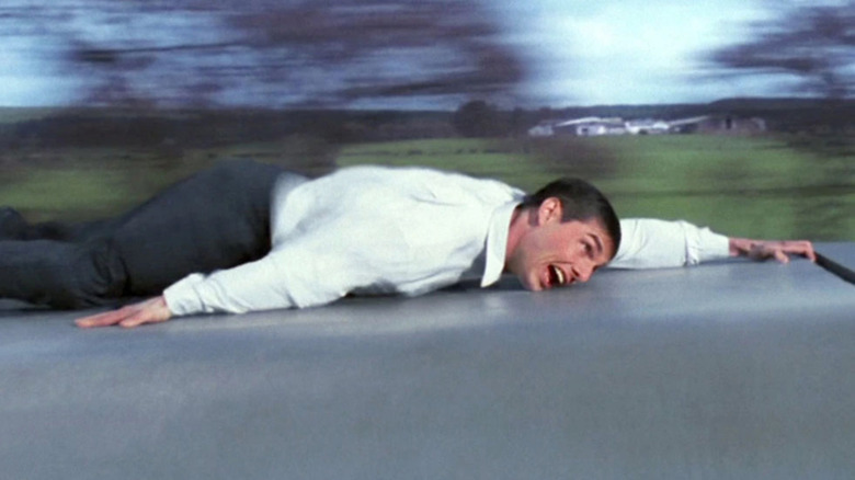 Tom Cruise hanging onto a train in Mission: Impossible