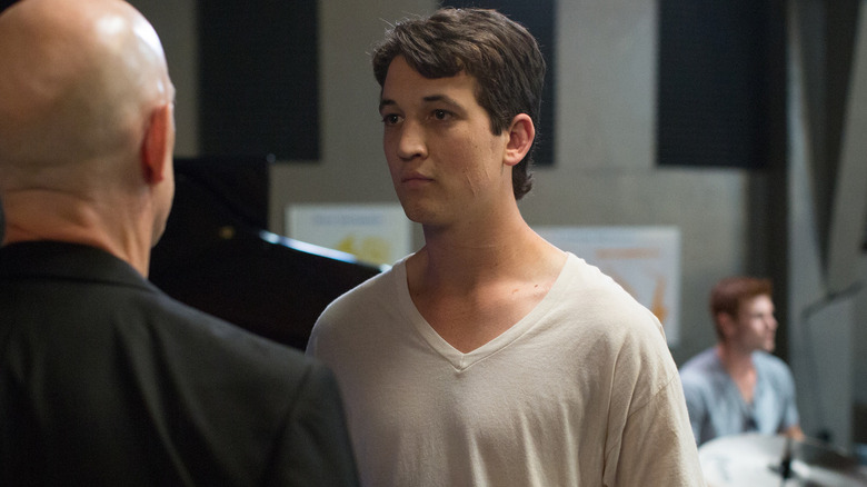 Miles Teller as Andrew Neiman staring at J.K. Simmons as Terence Fletcher in Whiplash