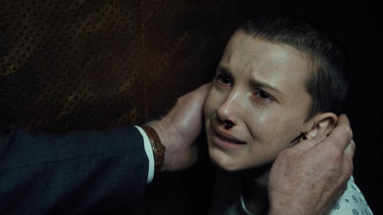 Eleven looking scared and helpless in Stranger Things season 1