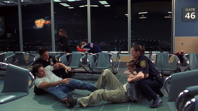 Airport security breaks up a fight as a plane explodes upon takeoff