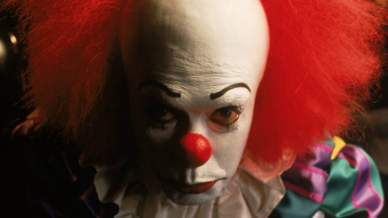 Tim Curry as Pennywise in It