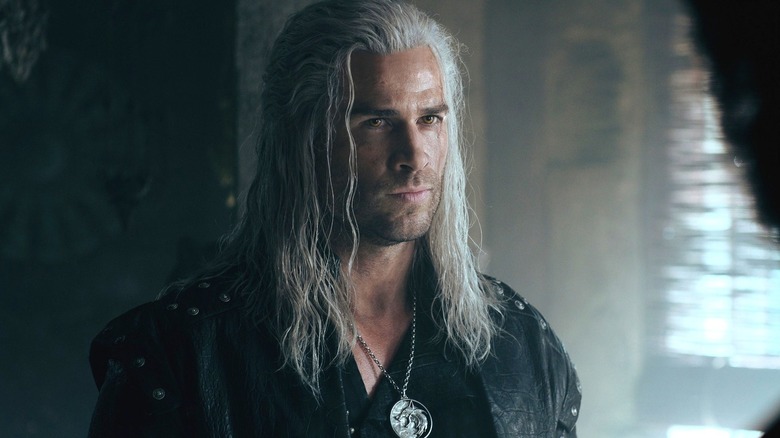 Geralt (Liam Hemsworth) stands confidently in The Witcher