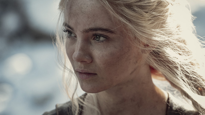 Ciri (Freya Allan) stands with sun shining in her hair in The Witcher