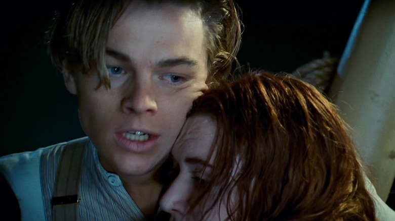 Leonardo DiCaprio as Jack Dawson and Kate Winsle as Rose DeWitt Bukatert holding each other in Titanic