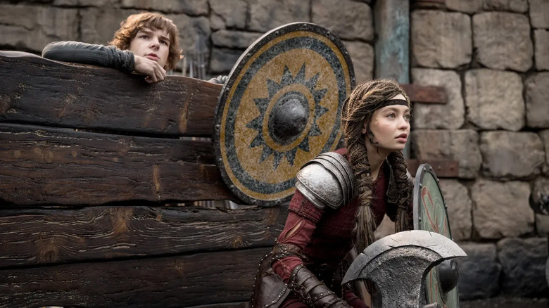 Hiccup (Mason Thames) and Astrid (Nico Parker) in the dragon training arena in How to Train Your Dragon (2025)