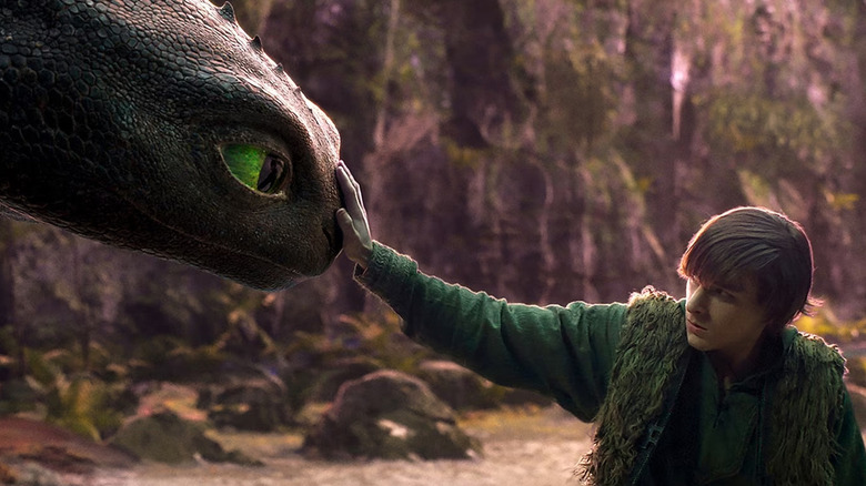 Hiccup (Mason Thames) touches Toothless in How to Train Your Dragon (2025)