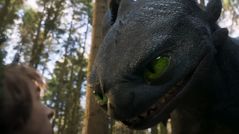 Hiccup (Mason Thames) looks scared as Toothless growls in How to Train Your Dragon (2025)