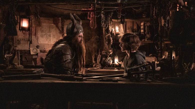 Gerard Butler as Stoick and Mason Thames as Hiccup having an intense conversation in How To Train Your Dragon