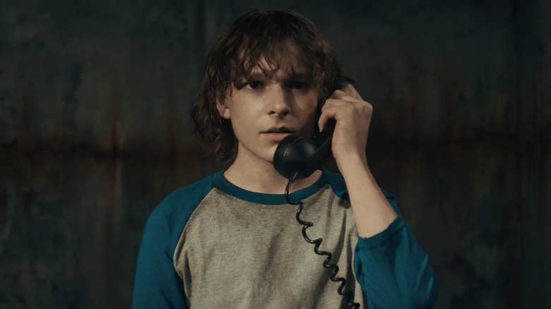 Mason Thames on a black phone