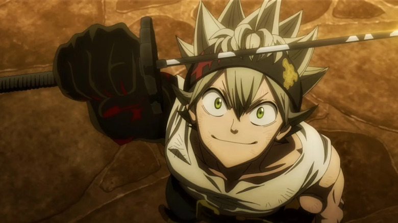 Asta raises his sword and smiles in Black Clover