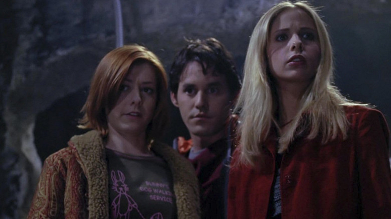 Buffy and Willow in the foreground in a shot from Buffy the Vampire Slayer