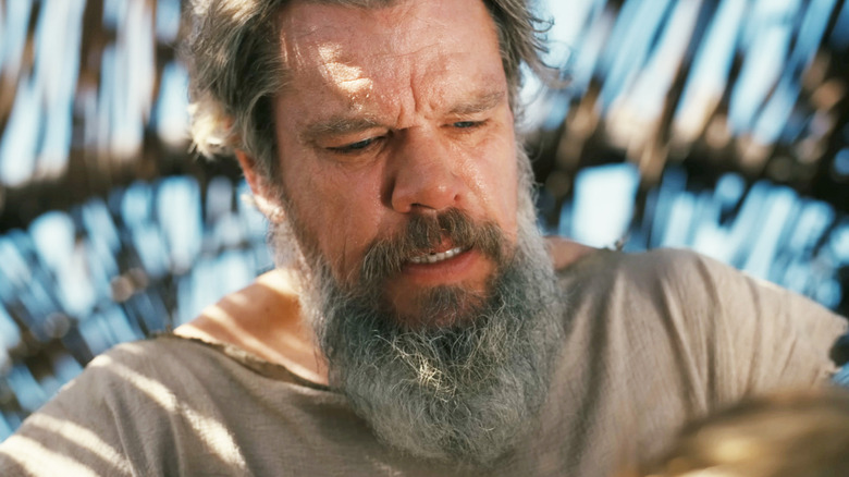 Matt Damon's Odysseus is seen looking worn out in closeup in The Odyssey