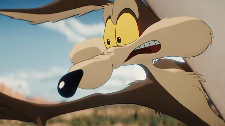 Wile E. Coyote reaching for the Road Runner in Coyote vs. Acme