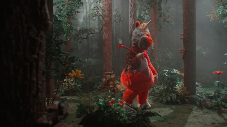 Buddy, bandaged with an axe in the woods, in Buddy