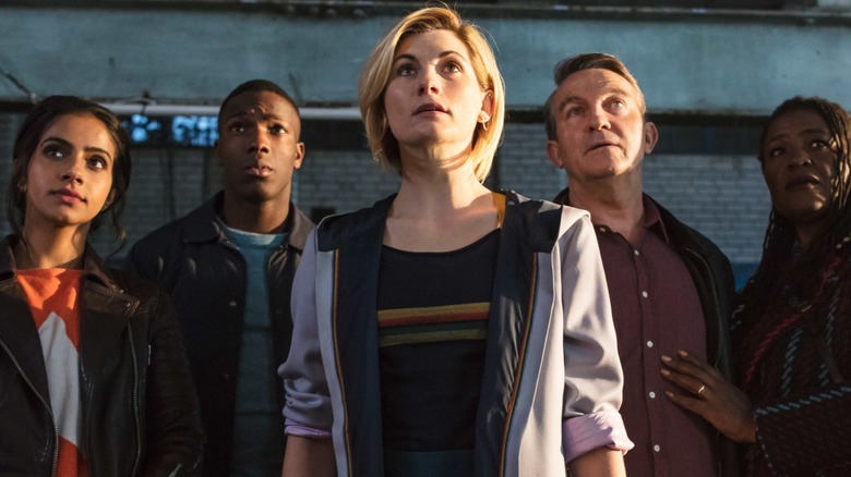 Doctor and companions staring