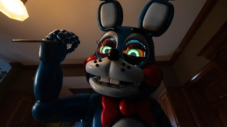 Toy Bonnie about to attack a woman in Five Nights at Freddy's 2