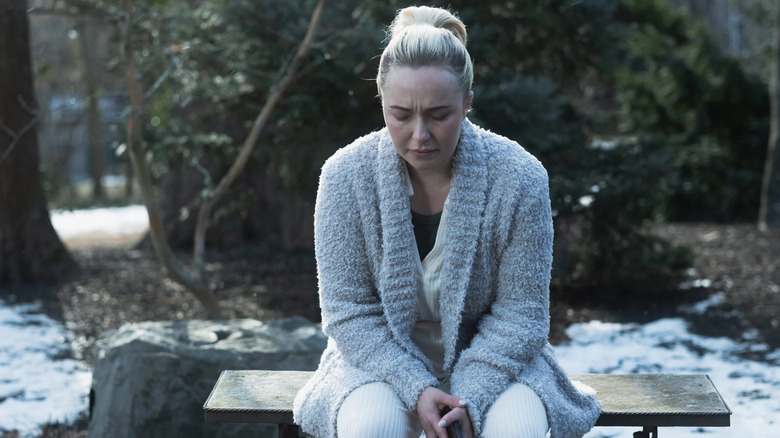 Sarah (Hayden Panettiere) sits on a bench with her eyes closed in Sleepwalker