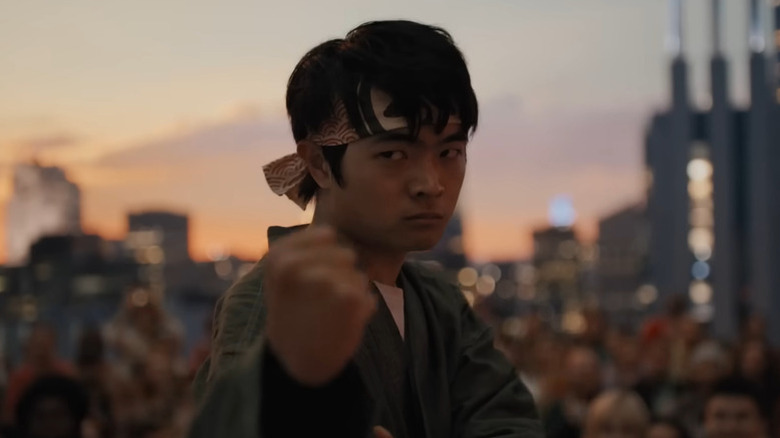 Li Fond striking a pose in Karate Kid: Legends